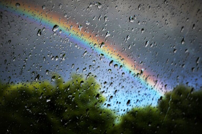 Wet weather with a rainbow